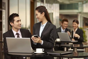Businessman and businesswoman having discussion