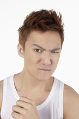 Man frowning and looking at the camera