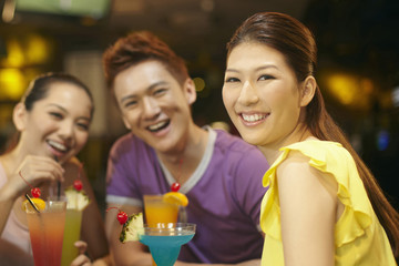 Friends chatting and drinking