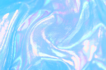 Blue and pink holographic fabric background