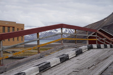 Old wooden bridge in Russian ghost town on Spisbergen.