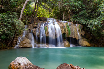 Beautiful soft waterfall with emerald green water in Erawan National Park in Kanchanaburi