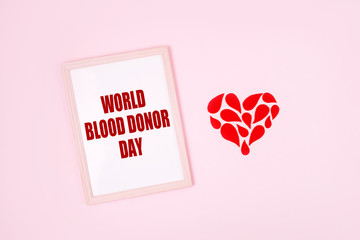 World Blood Donor Day. Blood donor day campaign for donation charity concept with red drops heart...