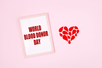 World Blood Donor Day. Blood donor day campaign for donation charity concept with red drops heart and hands. Giving blood saves lives