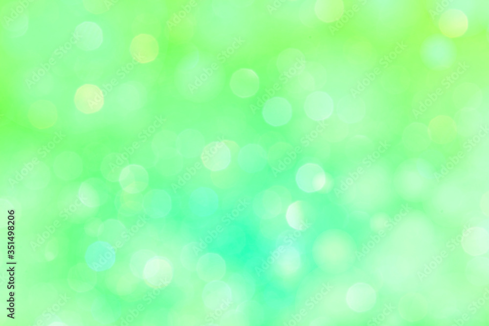 Wall mural bokeh pattern on a bright green background