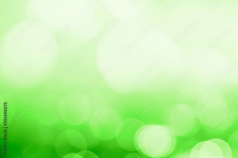 Wall mural bokeh pattern on a green background