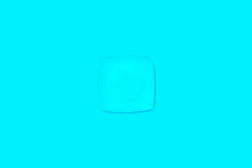 Blue cup on a blue background.