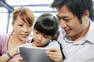 Family using digital tablet
