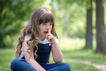Little girl  scratching nose for reflection, stress, cold or allergies
