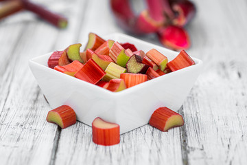 Chopped Rhubarb on an old wooden table (close up shot)