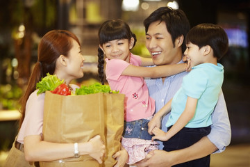 Family shopping for groceries together