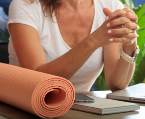 Woman and an exercise mat in an office background