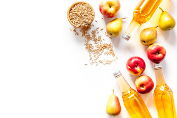 Apple and pear cider on white background top view copy space