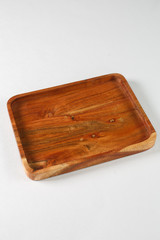 Brown wooden board for food on a white background