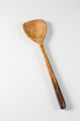 Wooden spoon on a white background