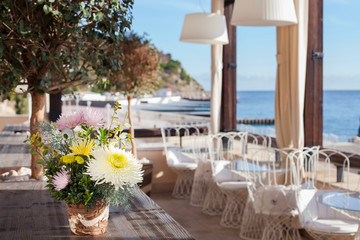 Outdoor summer terrace in a cafe by the sea.