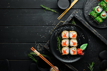 Sushi with crab and caviar cooked in oil. Sushi menu of Japanese restaurant. Top view. © Yaruniv-Studio
