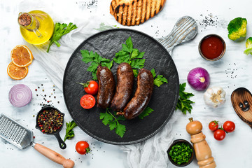 Baked blood sausage. Buckwheat sausage. Top view. Free space for your text.