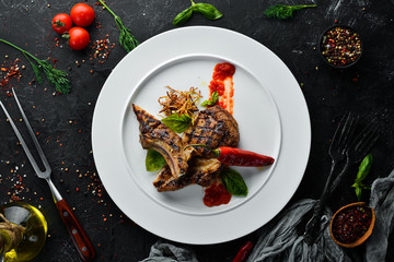 Grill a steak on the bone with chili. Dishes, food. Top view. Free space for your text.