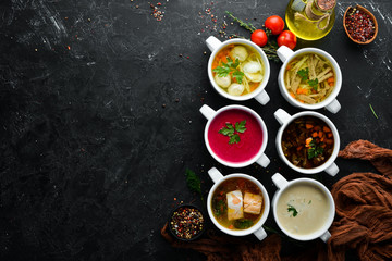 Set of soups. Meat soup, fish soup, chicken soup. Dishes, food. Top view. Free space for your text.