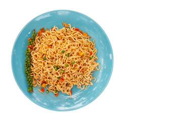 Top view of Spicy stir fried instant noodle in blue plate isolated on white background included clipping path.