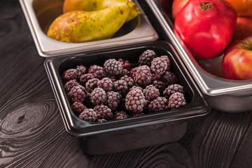 fruits and berries in iron trays