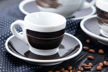 black cups on black background