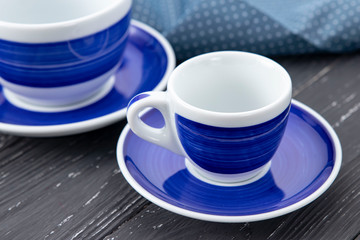 Fototapeta na wymiar blue cups on a gray background