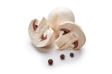 White mushrooms lie on a white background