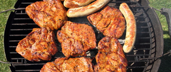 various meat and sausages on the charcoal grill