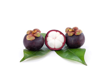 Whole and cut half Mangosteen with leaf is the queen of fruits isolated on white background. Sweet taste delicious.