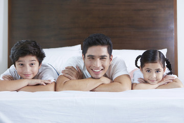 Cheerful family smiling at the camera