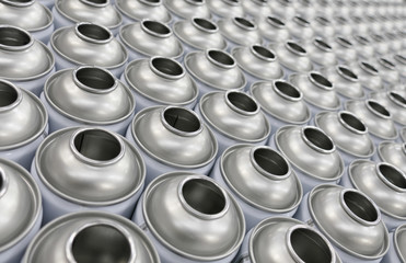 Empty aerosol cans in rows in factory awaiting filling process - obrazy, fototapety, plakaty