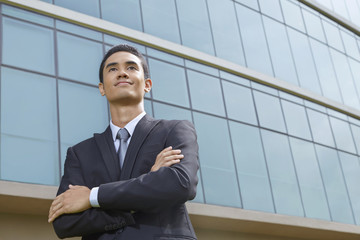 Cheerful businessman thinking