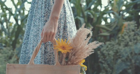 girl in blue dress walking