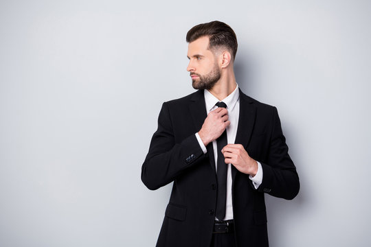 Profile side photo of masculine gentleman worker man adjust his tie prepare for business meeting with partners look copyspace wear classy outfit isolated over grey color background