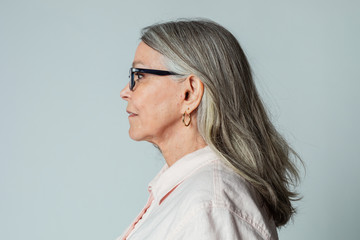 Senior woman wearing eyeglasses in a profile shot