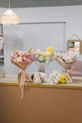 Five beautiful bouquets of flowers. Flower shop concept. Stylish bouquets of flowers.