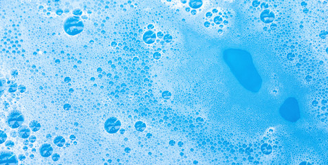 soap bubble foam macro blue background