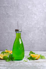Green liquid in a glass bottle