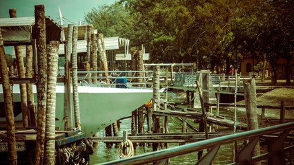 Big white boat docked by the pier