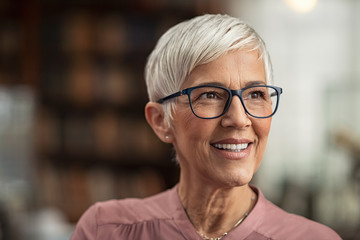 Senior woman smiling with eyeglasses