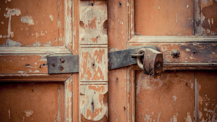 Close up of a rusty padlock on the door