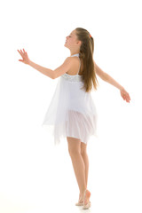 Naklejka premium Inspired Teenage Girl Wearing White Sport Dress Dancing