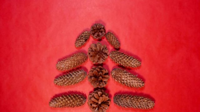 Merry Christmas stop motion logo. Christmas tree from pine cones animation 4K