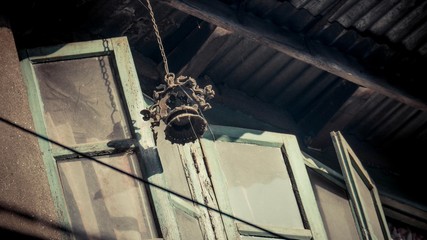 Green window door with glass and bells