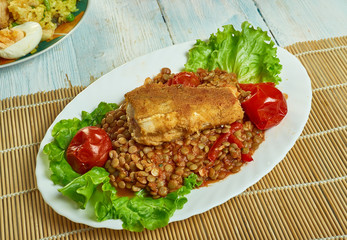 Harissa crumbed fish with lentils