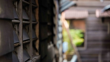 Layers of glass window between wooden wall