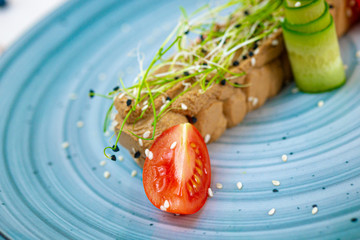 vegan soy pate with tomatoes and herbs