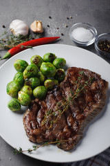 Meat steak with Brussels sprouts, close-up